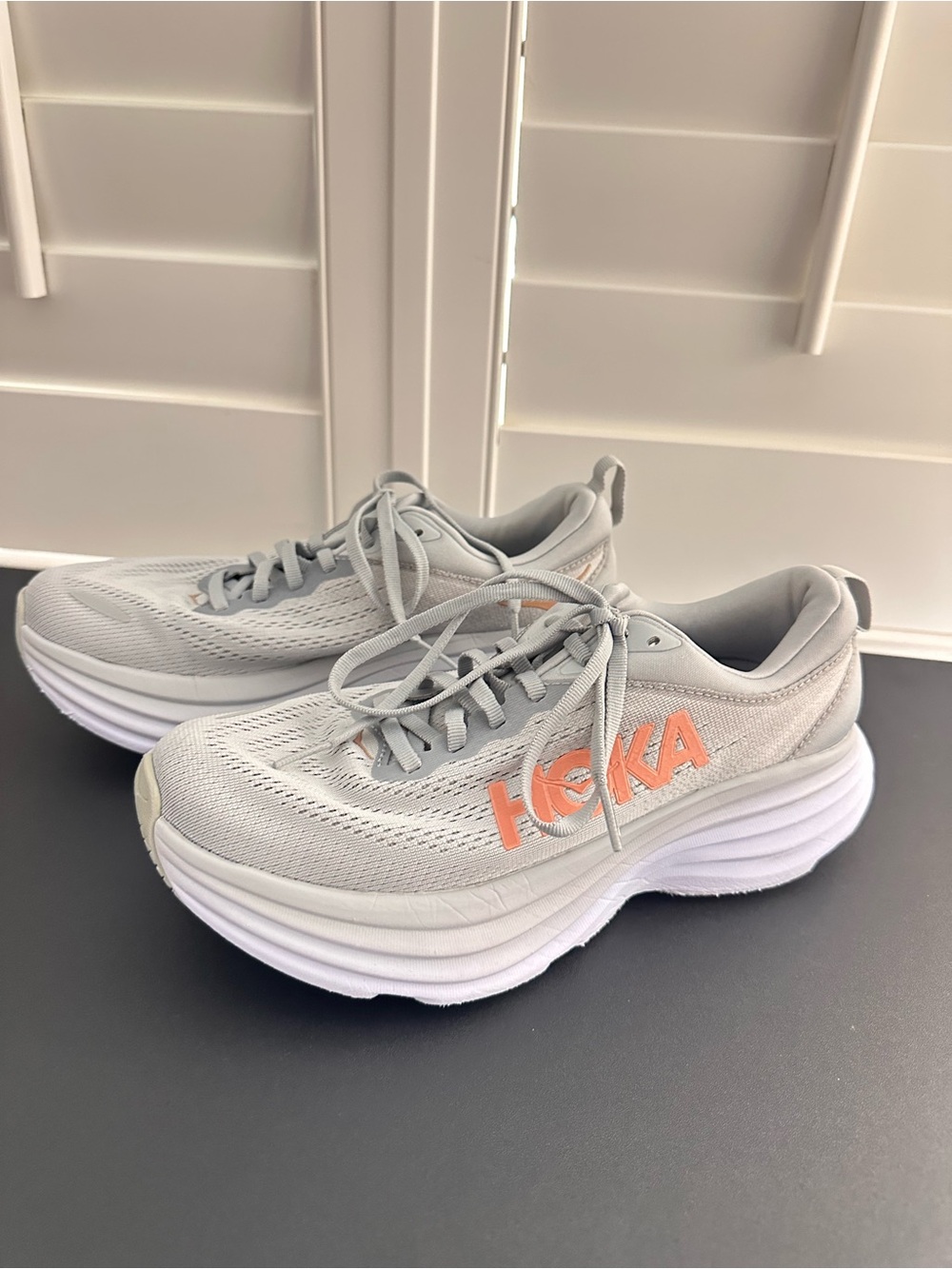 Hoka Women's Bondi size 7.5 in Light Gray with Coral Logo